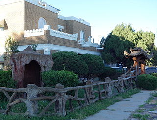 Gate, Fence and Hollow Tree Shelter Designed by Dionicio Rodriguez